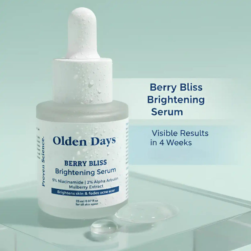 Bottle of Olden Days Berry Bliss Brightening Serum with berries on a light green background